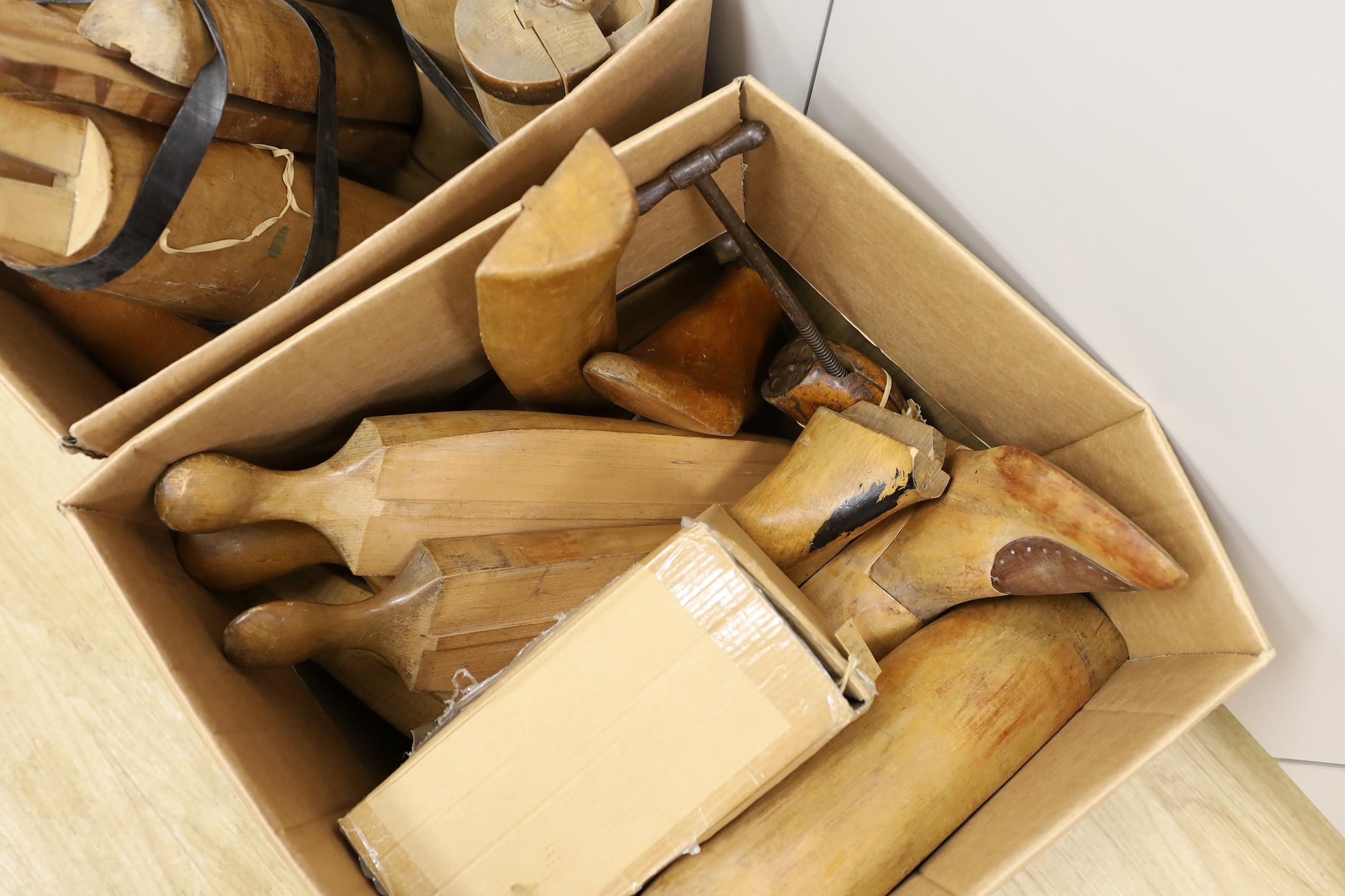 An assortment of beech boot-trees and folding boot hooks